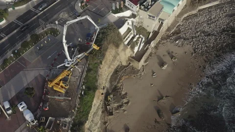 Solving Soil Erosion Issues at Sao Pedro Do Beach Using Machinery Stock Footage 344749176