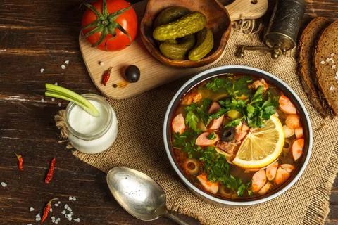 Solyanka, a thick soup with different types of meat and sausages, with the Stock Photos