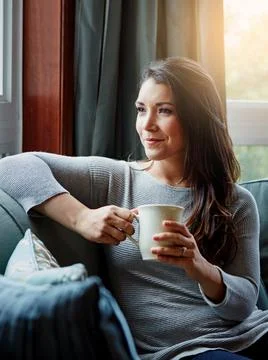 Some alone time can do you a world of good. an attractive young woman relaxing Stock Photos