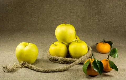 Some apples and tangerines Stock Photos