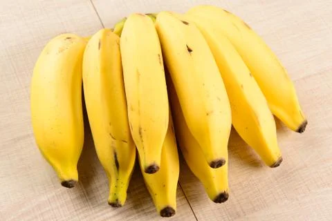 Some bananas on the table Stock Photos