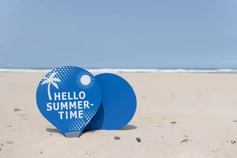 Some beach rackets placed in the sand of a beach Stock Photos