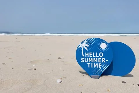 Some beach rackets placed in the sand of a beach Stock Photos