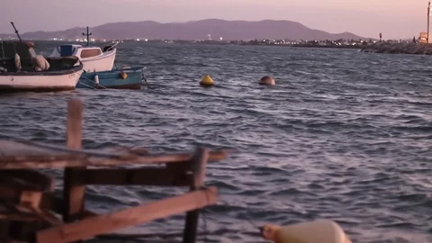 Some boats gently moved by the waves Stock Footage 114291893