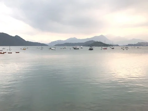 Some boats on the lake, cloud and the mountain Video stock 75705093