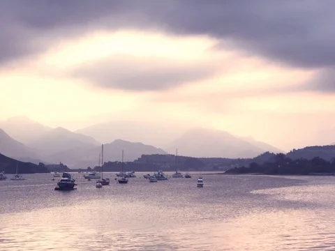 Some boats on the lake, cloud and the mountain Video stock 75705097