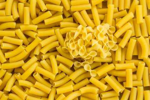 Some bow tie shape macaroni on Short Cut Pasta Background Stock Photos