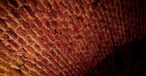 Some bricks on the wall are darkened to the point it is about to turn to black. Stockbeeldmateriaal 79958893