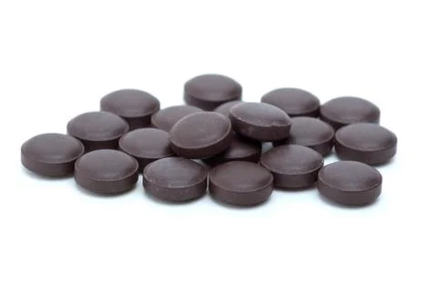 Some brown tablets isolated on the white background Stock Photos