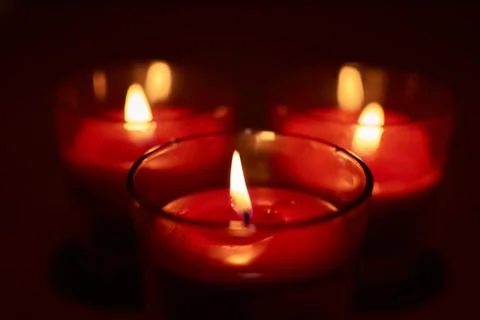 Some burning red candles Stock Photos