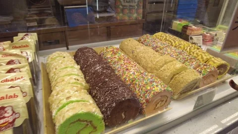 Some cakes and biscuits are seen in a shop Changi Airport Singapore Stock Footage 299670417