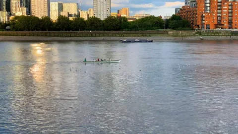 Some canoeists training on the river thames London Stock Footage 114269040