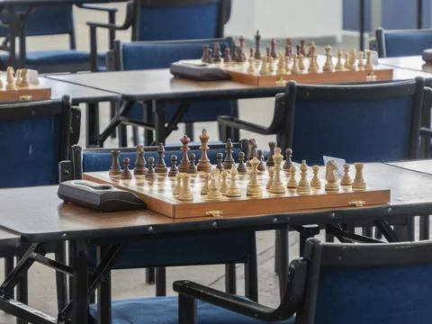 Some chess boards on the tables ready for competition Stock Photos