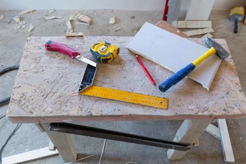 Some construction materials - ruler, construction knife, tape-measure and pencil Stock Photos