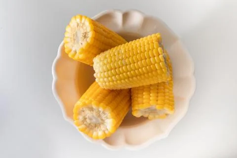 Some corn cooked very soft, hot and yellow. Stock Photos