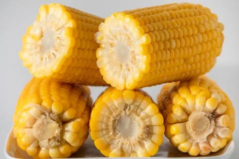 Some corn cooked very soft, hot and yellow. Stock Photos