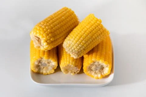 Some corn cooked very soft, hot and yellow. Stock Photos