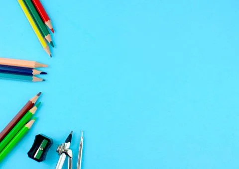 Some different colored pencil crayons ,a black pencil sharpener and a pencil Stock Photos