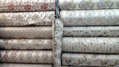 Some different colours of printed curtain and sofa clothes 動画素材 166936199