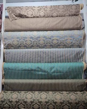 Some different sofa and curtains clothes roll with different designs Stock Photos
