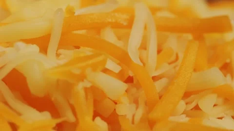 Some different sorts of grate cheese on plate close up macro. Chef grating Stock Footage 257084952