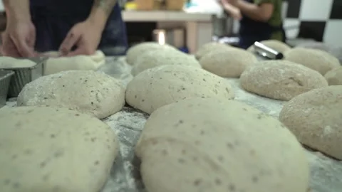 Some dough buns placed over a countertop of a kitchen restaurant Stock Footage 240788667