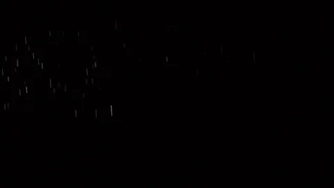 Some dust of liquid particles flowing on dark background Stock Footage 75099191