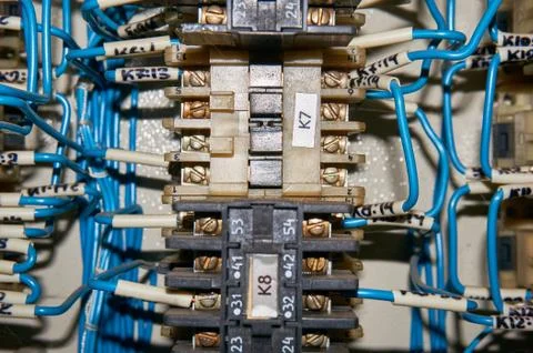 Some electrical relay is mounted on the mounting panel. Stock Photos