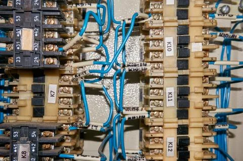 Some electrical relay is mounted on the mounting panel. Stock Photos