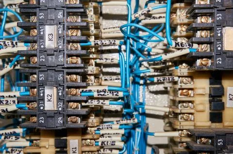 Some electrical relay is mounted on the mounting panel. Stock Photos