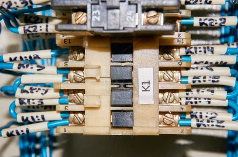Some electrical relay is mounted on the mounting panel. Stock Photos