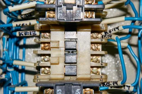 Some electrical relay is mounted on the mounting panel. Stock Photos