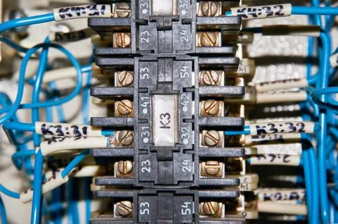 Some electrical relay is mounted on the mounting panel. Stock Photos