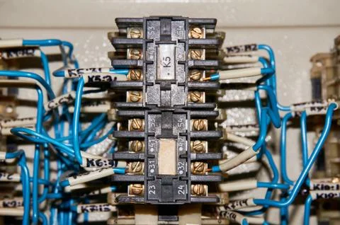Some electrical relay is mounted on the mounting panel. Stock Photos