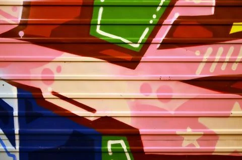 Some elements of a large and composite graffiti pattern on the wall, made wit Stock Photos