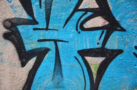 Some elements of a large and composite graffiti pattern on the wall, made wit Stock Photos