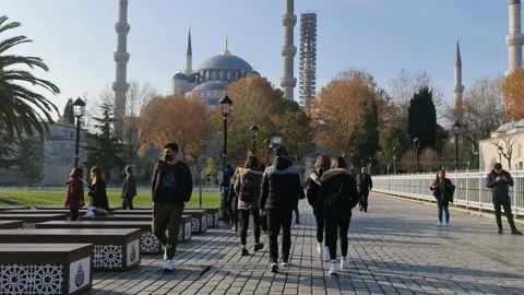 Some foreign tourists are in front of a very famous mosque in Istanbul, Turkey. Stock Footage 210232078