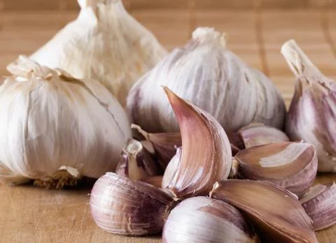 Some garlic cloves Stock Photos
