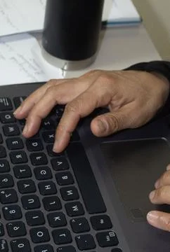 Some hands on a computer Stock Photos