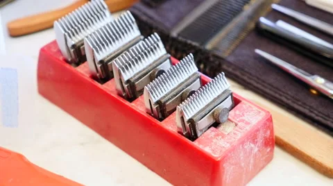 Some head lames in a red box at the barbershop Stock Footage 58673270