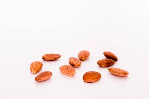 Some isolate Almonds on a white table. Foto stock
