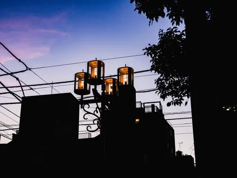 Some lights that are on a pole Stock Photos