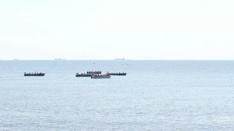 Some liitle ships floating away in the sea Stock Footage 12273836