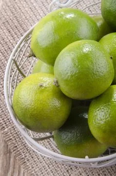 Some lime in a small basket Stock Photos
