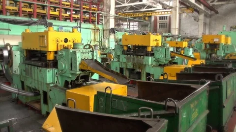 Some metal rings roll down from a forging press in a workshop at a plant Stock-Footage 82295218