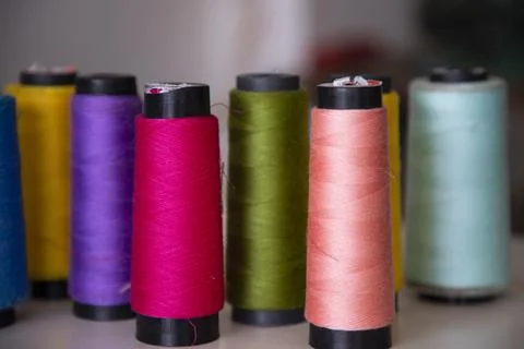 Some multicolor Spools of  swings thread Close-up Focus Stock Photos