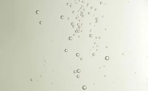 Some nice cold champagne bubbles soars over a blurred background Stock Photos