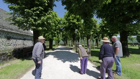 Some older persons playing petanque Stock Footage 131305889