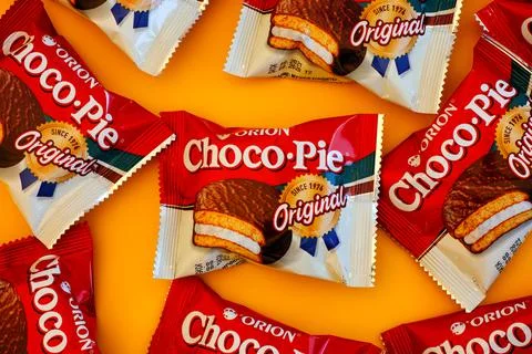 Some Orion Choco-Pie snack cakes on yellow background. Stock Photos