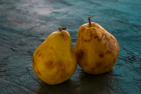 Some pears on a dark table Stock Photos